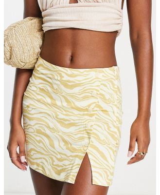 Edited wrap front mini skirt in yellow zebra (part of a set)
