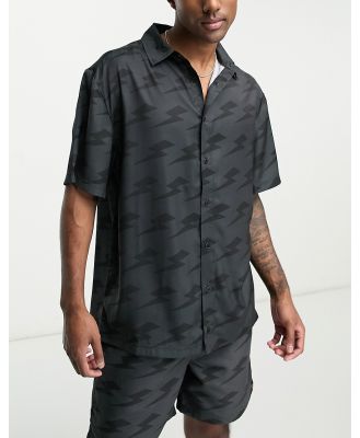 ellesse Capri shirt with lightning bolt print in black (part of a set)