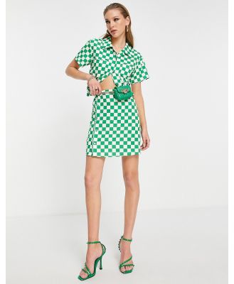 Extro & Vert button up mini skirt in bold green checkerboard