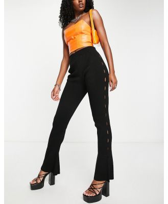 Fashionkilla flared rib pants with cut out sides in black