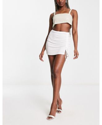 First Distraction the label ruched mini skirt in cream-White