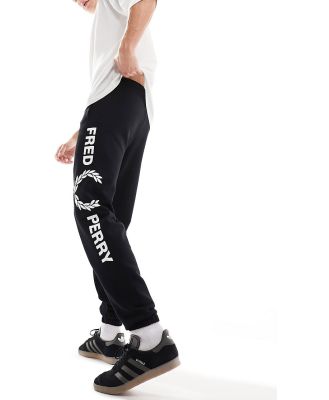 Fred Perry graphic branded trackies in black