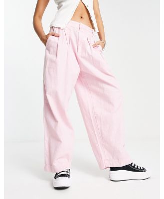Free People baggy fit linen pants in bleached pink