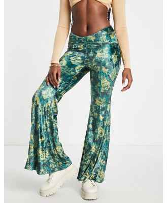 Free People paisley print velvet low rise flares in emerald green