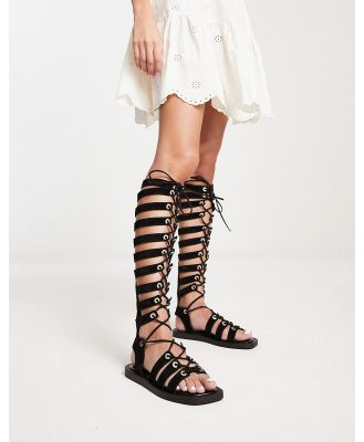 Free People Sun Chaser tall gladiator sandals in black