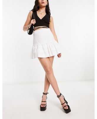 Glamorous boho mini skirt with ruffle detail in white