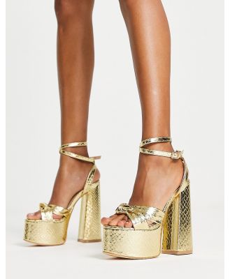 Glamorous platform heel sandals in gold snake