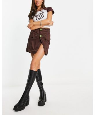 Heartbreak button front mini skirt with contrast stitch in chocolate brown