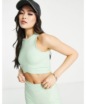 HIIT peached racer back tank in light green