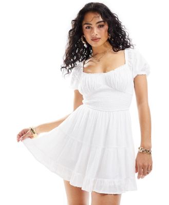 Hollister smocked waist mini dress with pockets and hidden shorts in white