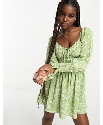 In The Style x Jac Jossa milkmaid shirred cuff mini dress in green floral-Multi