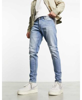 Jack & Jones Intelligence Pete tapered fit jeans in light blue wash