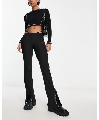 Karl Kani small signature flared leggings in black with hip string detail