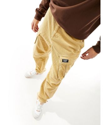 Karl Kani straight leg cord cargo pants in beige with logo print-Neutral
