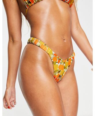 Kulani Kinis x Hannah Meloche retro high leg bikini bottoms in multi lemon & oranges print