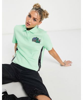 Lacoste boxy polo with large logo in green