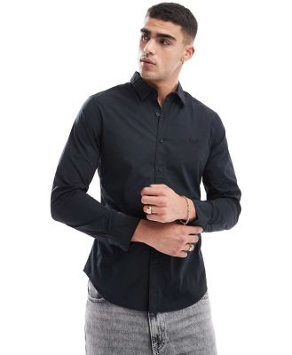 Levi's Battery batwing logo slim fit poplin shirt in black