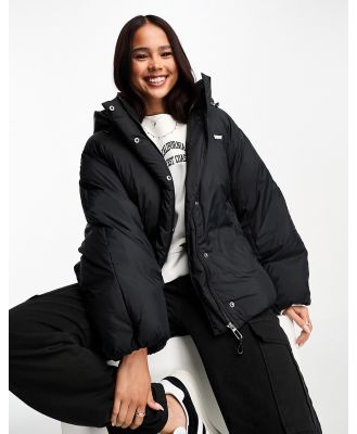Levi's Down Bubble hooded puffer jacket in black with logo