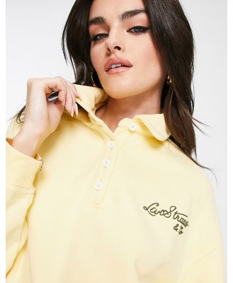 Levi's vintage sport script logo cropped polo shirt in yellow