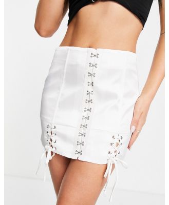 Lioness Infatuation lace up mini skirt with hook detail in white