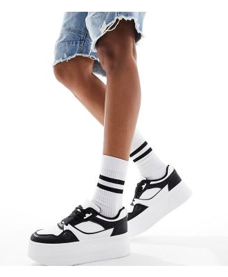 London Rebel Wide Fit chunky panelled flatform sneakers in white and black