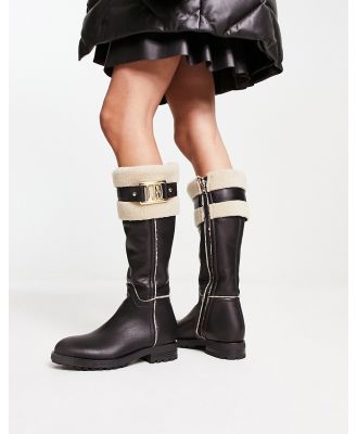Love Moschino faux fur trimmed knee boots in black and cream