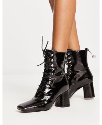 Love Moschino lace up boots with zip back in black