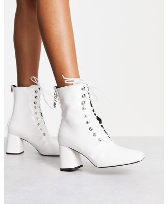 Love Moschino lace up boots with zip back in white