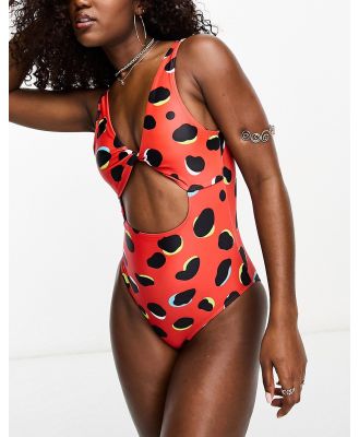 Luxe Palm cut out low back swimsuit in red dotty print