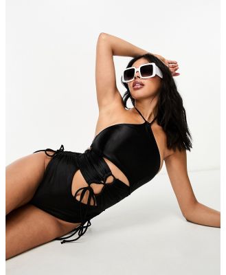 Luxe Palm cut out strappy halterneck swimsuit in black