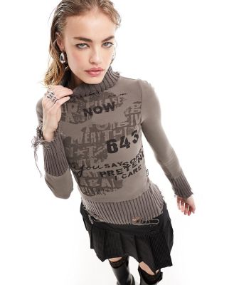 Minga London distressed roll neck jumper with retro graphics in taupe-Brown