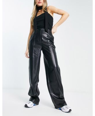 NA-KD x Angelica Blick faux leather high waisted pants in black