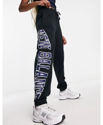 New Balance large logo trackies in black