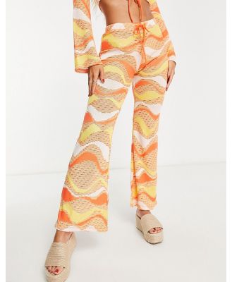 New Girl Order festival knit tie front flare pants in orange (part of a set)