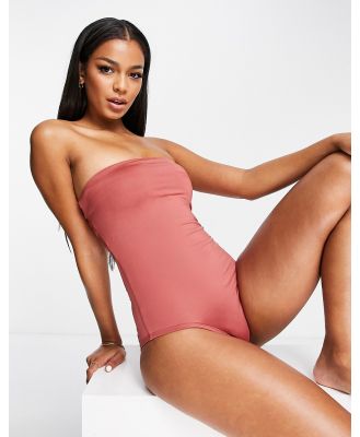 Nike Swimming solid lace-up bandeau one piece swimsuit in pink