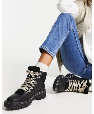 Only chunky lace up boots with faux fur trim in black