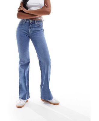 & Other Stories low rise flared jeans in mid blue wash