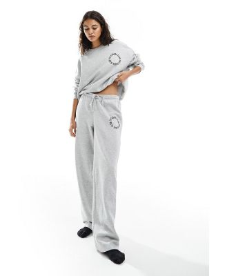 Pieces 'the casual club' slogan wide leg trackies in grey (part of a set)