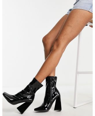 Public Desire Craving flare heel ankle boots in black patent