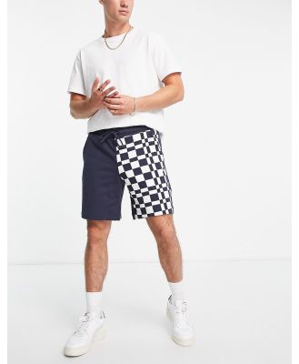 Puma Downtown shorts in checkerboard colour block in navy and white