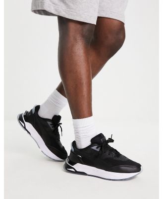 PUMA Mirage Sport trainers in black and silver