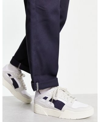 PUMA Slipstream Lux sneakers in PUMA white and navy