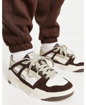 PUMA Slipstream sneakers in off white and dark brown