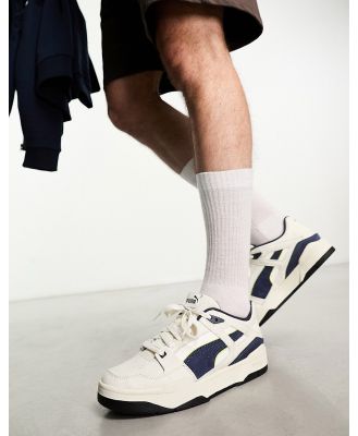 PUMA Slipstream sneakers in off white and navy