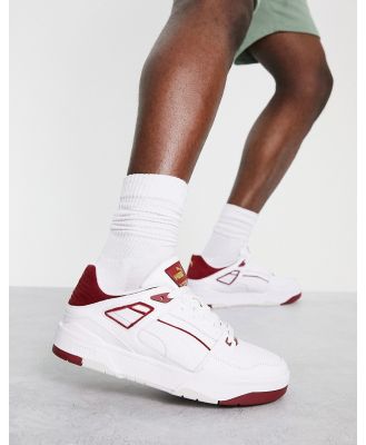 Puma Slipstream sneakers in white and red