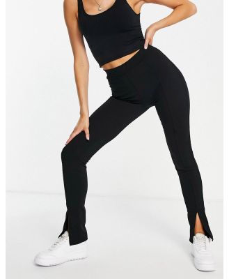 Rebellious Fashion split front flared pants in black
