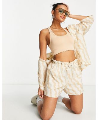 Reebok Summer Waves paperbag shorts in sand-Neutral