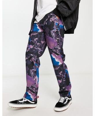 RIPNDIP Ultralight Beam casual pants in black with all over art print-Multi