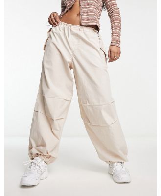 River Island low rise parachute cargo pants in beige-Neutral