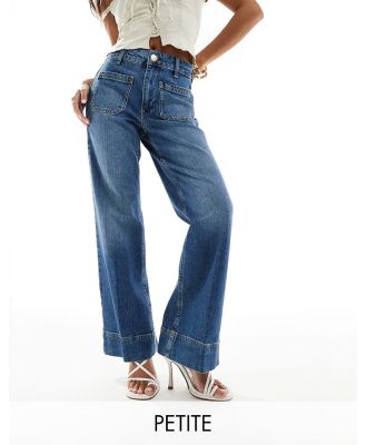 River Island Petite flared jeans in mid blue